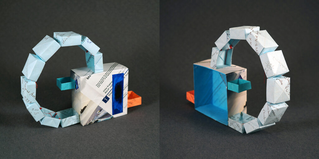 Two views of a small sculpture by artist Joanna White, featuring paper boxes and paint.
