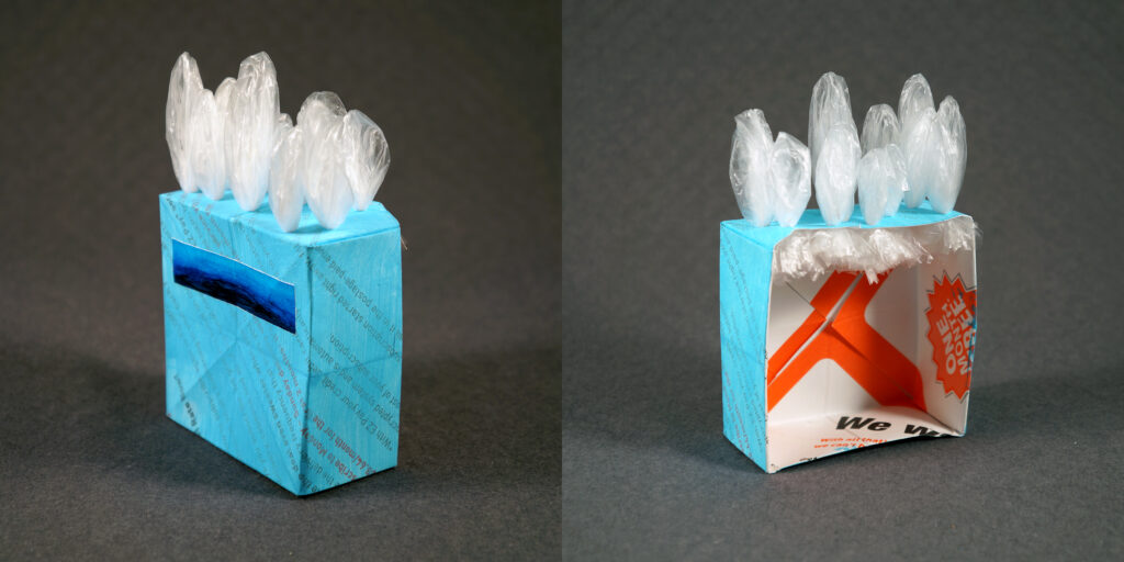 Two views of a small sculpture by artist Joanna White, featuring paper boxes and paint.
