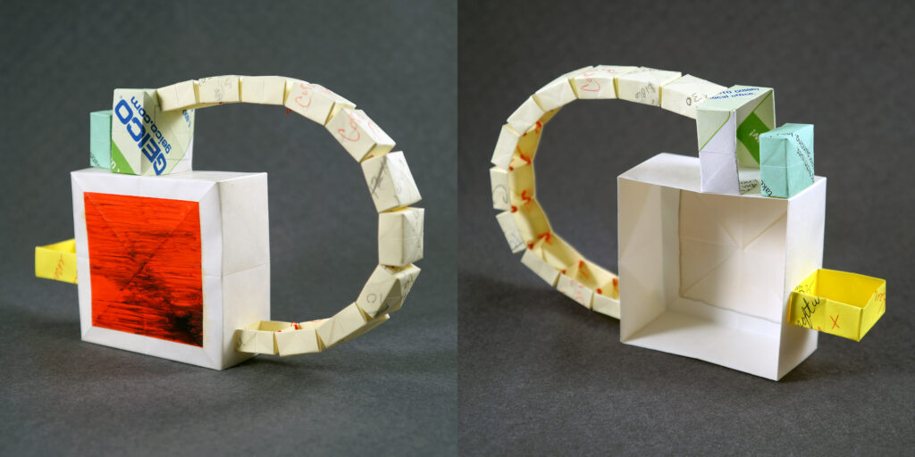 Two views of a small sculpture by artist Joanna White, featuring paper boxes and paint.