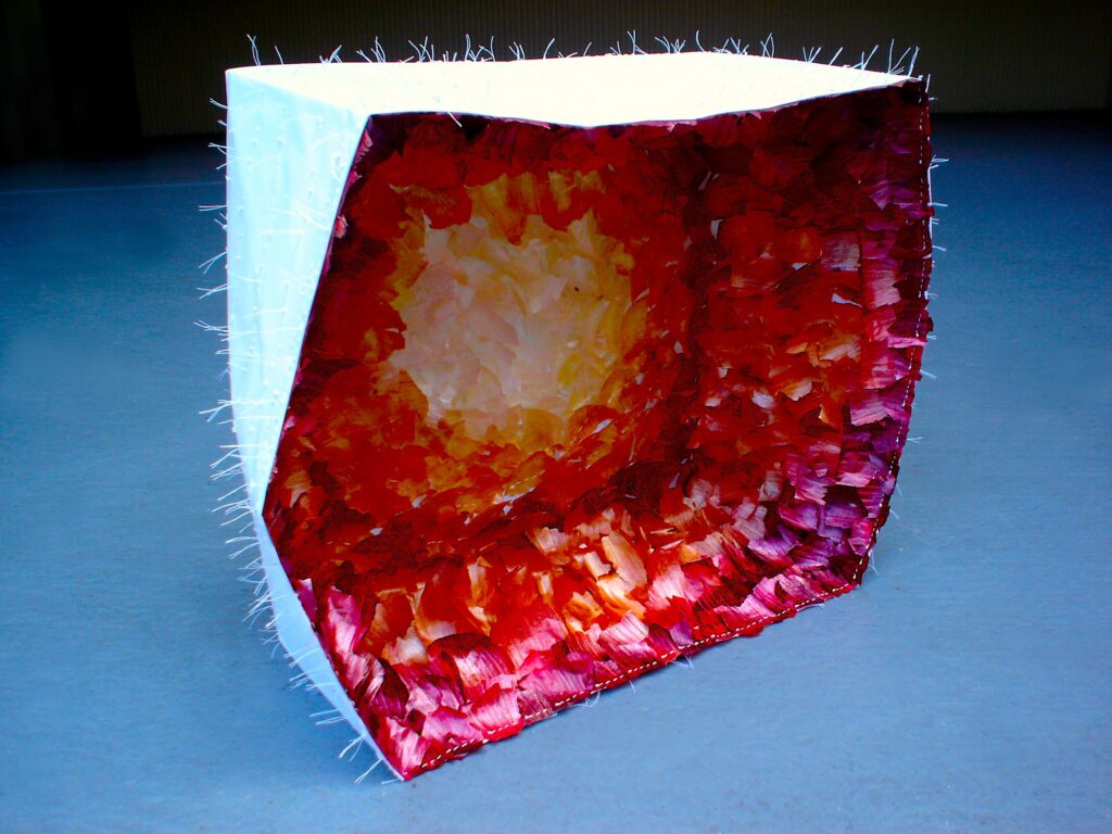 A large paper sculpture by Joanna White filled with hand-sewn natural onion skins that fade gradually from deep purple to white.