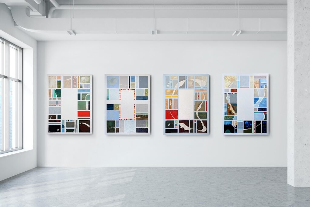 A row of geometric, abstract paintings on a wall by artist Joanna White.